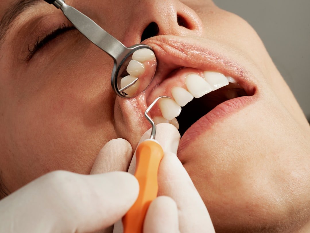 dental-exam-with-mirror-and-tool-8bkf0stc6uo
