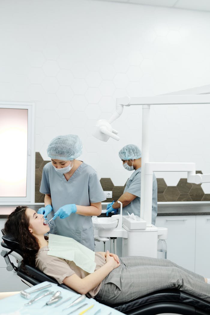 A dentist performs a dental procedure on a patient in a modern clinic setting, emphasizing healthcare.